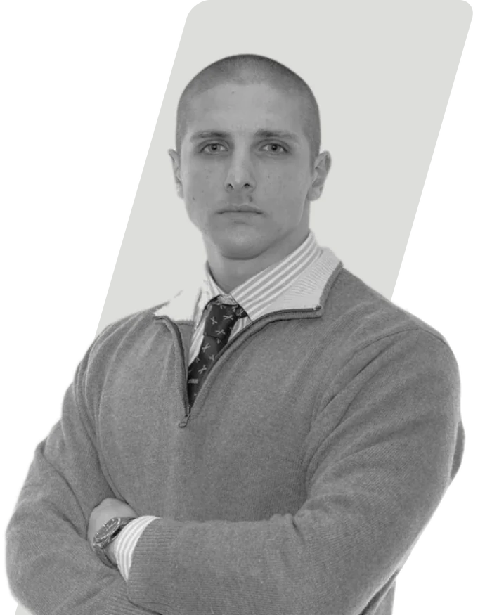 Fabrizio Longato, arms folded, in black and white.