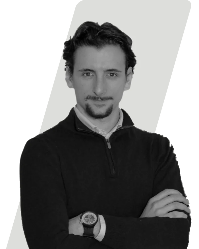 Riccardo Longato, arms folded, in black and white.